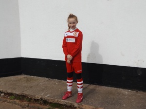 Walsall Wood mascot. Miss Mollie  Stretton ready to lead the players on to the pitch to start the game